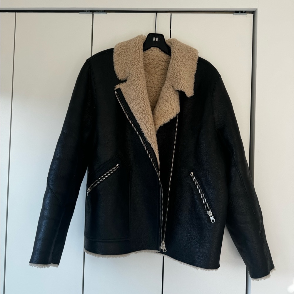 Sandro shearling coat in 3 / L. Worn but in good condition
